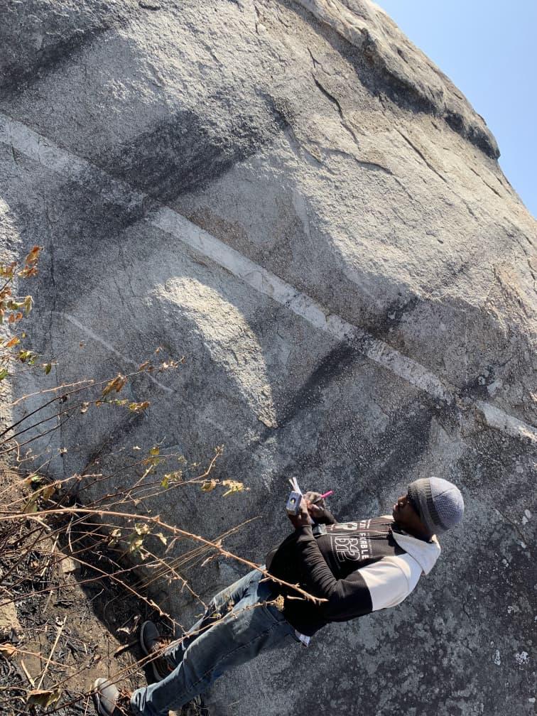 Geoscientist at a field outcrop